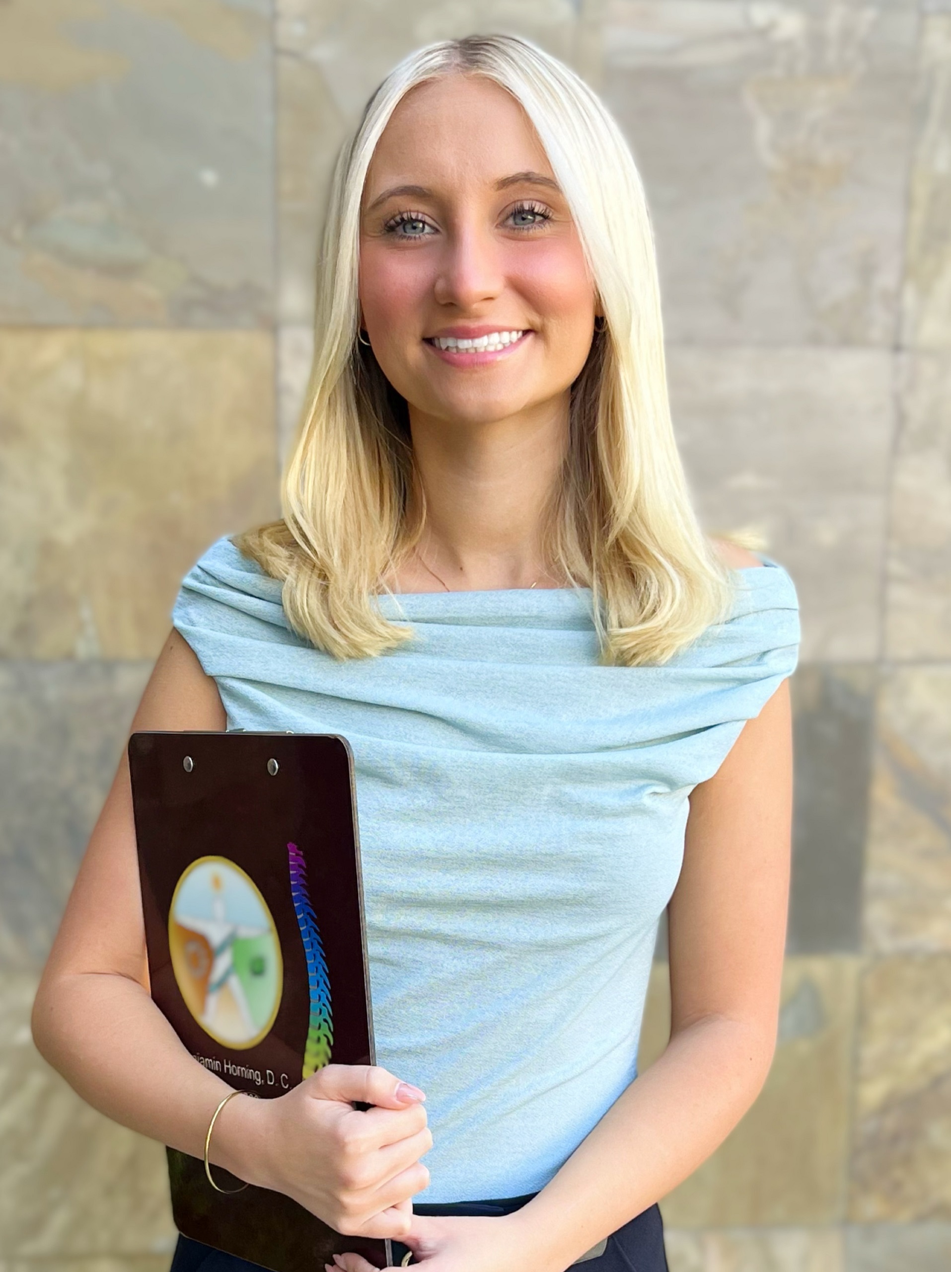 Anna Holding A Clipboard
